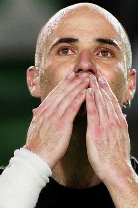 January, 2004.  Andre Agassi blows a farewell kiss to the crowd following his loss to Marat Safin in their men's singles semi-final at the Australian Open.