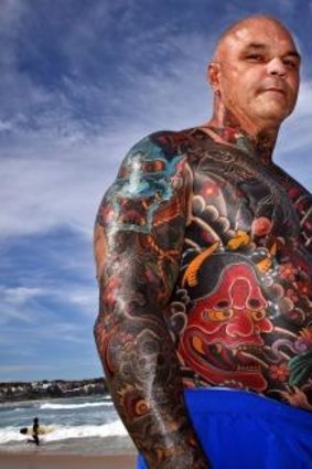 Tattooed man: Paul Roberts on Bondi Beach.