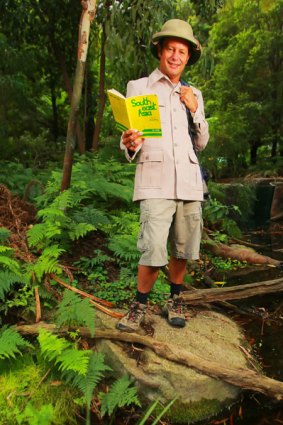 Ghosts of travel-guides past: Brian Thacker, posing here in the jungles of Melbourne Museum, set out to see the world armed only with a 1974 book by Lonely Planet founders Maureen and Tony Wheeler.
