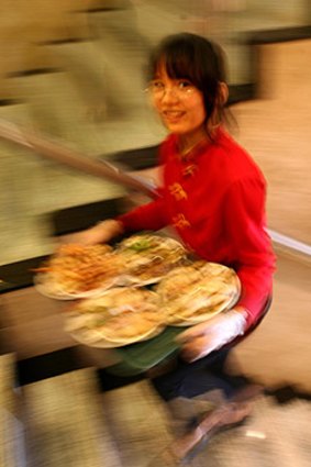 Express delivery ... a waitress shuttling food between floors at Sunny Harbour.