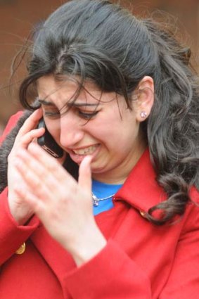 Upset: a woman reacts after the explosions rocked the finish area of the Boston Marathon.