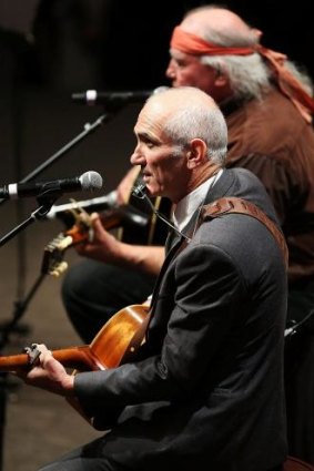 Paul Kelly performs at the state memorial service for former Australian Prime Minister Gough Whitlam in November 
