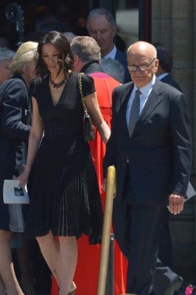 Rupert Murdoch and his wife, Wendi Deng, outside the cathedral.