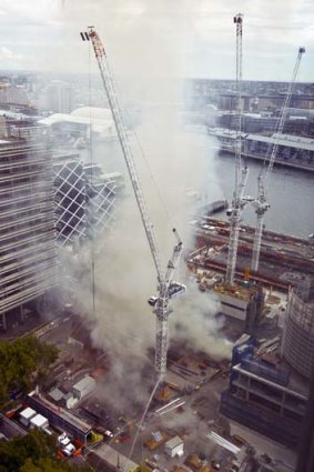 At risk: The cranes affected by fire will need to be removed once the fire is under control.