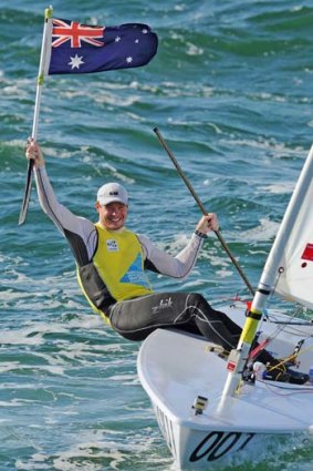Victorious ... Australia's Tom Slingsby celebrates after winning the gold medal race.