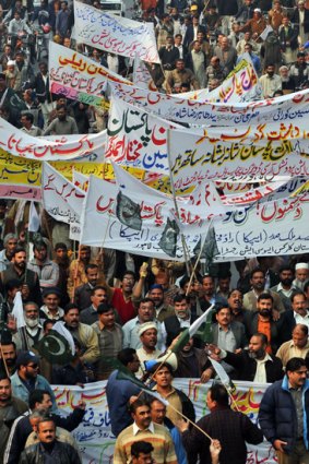 Demonstrators march in support of the Pakistani army during a protest against terrorism in Lahore.