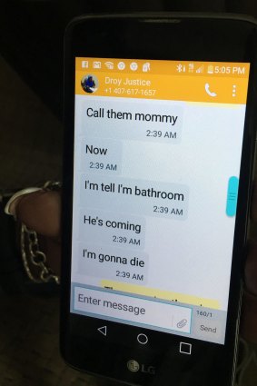 Mina Justice shows a text message she received from her son Eddie Justice.