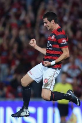 The equaliser: Tomi Juric celebrates a goal against Brisbane last Saturday.