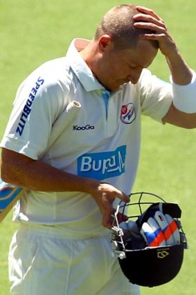 Quick exit ... Brad Haddin heads from the field after being dismissed for a duck.