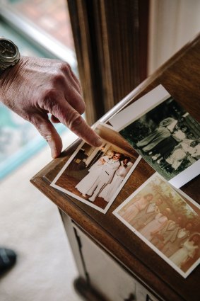 "She was good at brushing people off": Bob Hutchinson shows some family photos at his house in Pacifica, California.