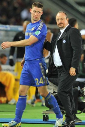 Rafael Benitez consoles Chelsea defender Gary Cahill after he received a red card during the Club World Cup final.