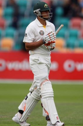 Dismissed cheaply ... Usman Khawaja trudges off after being caught..