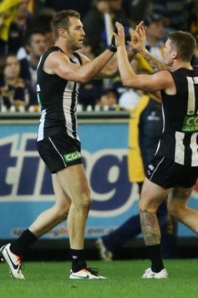 Travis Cloke celebrates a goal against the Eagles. The big forward has had a muted start to the season.