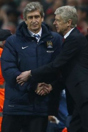 In the hunt?: Manchester City's Manuel Pellegrini and Arsenal's Arsene Wenger.