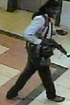 A suspected militant holds a gun in Westgate mall, during the al Shabaab attack on the complex that killed 67 people on September 21.