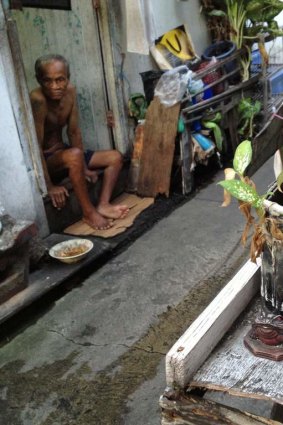 The narrow streets are crowded with people and goods.