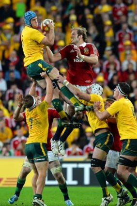 James Horwill (top left) grabs the ball before Alun Wyn Jones during a lineout on Saturday.