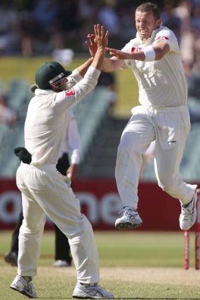 Time to celebrate ... Australia's Peter Siddle, right, celebrates taking the wicket of South Africa's Dale Steyn.