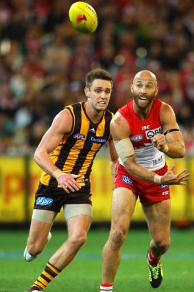 Swan Jarrad McVeigh handballs during the qualifying final match against Hawthorn on Friday. Sydney hopes he will be fit for the semi-final against Carlton.