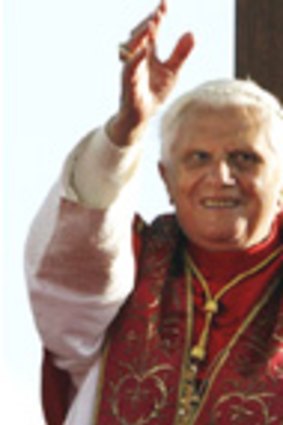 Pope Benedict XVI waves to the crowd of 150,000 young pilgrims today in Sydney.
