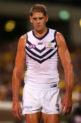 Aaron Sandilands heads to the rooms for treatment after the clash.