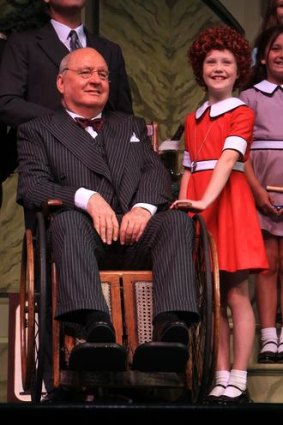 New role the wheel deal: Alan Jones with the cast of <i>Annie</i>.