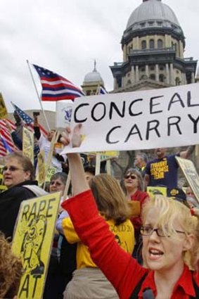 Pro-guns ... a group of protesters push for ''concealed carry'' laws which would allow for pistols to be taken into most public places.