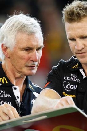 They both look like Collingwood coaches... but this picture was taken in 2011, when Mick Malthouse was boss, and Nathan Buckley was assistant coach.