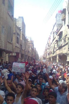 Demonstrators march through the streets of Damascus last Friday.