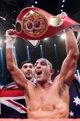 Australia's Sam Soliman celebrates with the IBF World Middleweight Championship Belt after a unamimous points victory over Felix Sturm.