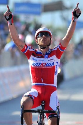 Italy's Luca Paolini crosses the finish line to win the third stage of the Giro d'Italia, from Sorrento to Marina di Ascea, on Monday.