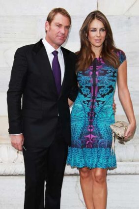 A 'natural' Shane Warne and Liz Hurley at Cavalli's Milan s/s 2013 show.