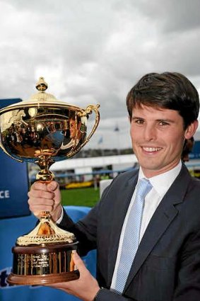 James Cummings poses with the Moonee Valley Cup.
