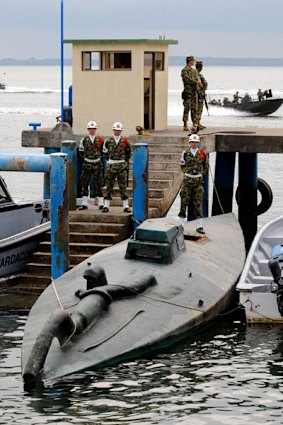 On guard: Colombian soldiers watch over a cocaine seizure this week. General Montoya was seen as an ally in the US war on drug cartels.