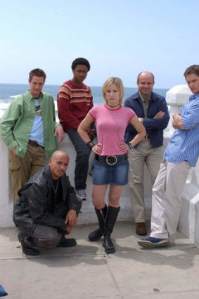 Reunited: The cast from the first season of Veronica Mars in 2004, (from bottom left) Francis Capra, Jason Dohring, Percy Daggs III, Kristen Bell, Enrico Colantoni and Teddy Dunn. All have returned for the movie version.