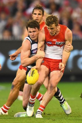 Brownlow Medallist Patrick Dangerfield and second placegetter Luke Parker duel on the field.