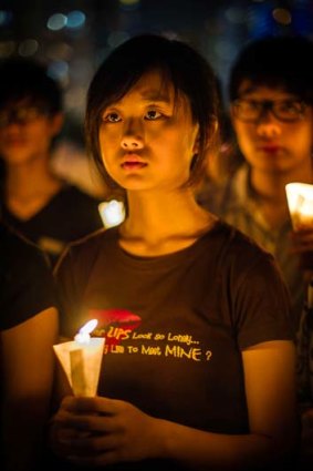 Never forget &#8230; a Hong Kong girl in a candlelight vigil.