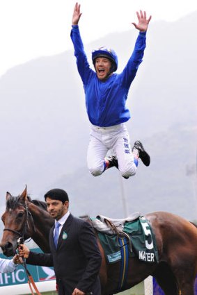 Frankie Dettori performs his famous star jump.