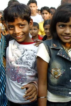 Azharuddin Ismail, left, who played the young Salim, and Rubina Ali, who played the young Latika at a Mumbai slum in 2009.