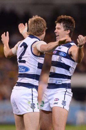 Cat attack: Billie Smedts and Andrew Mackie celebrate.