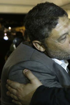 Home free: Released hostage Ali Abbas, right, is kissed by a relative upon his arrival at Beirut-Rafik Hariri International Airport.