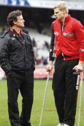 St Kilda captain Nick Riewoldt talks to coach Scott Watters after the match against  Melbourne on Saturday.