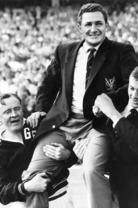 As coach, Bob Davis is chaired off the MCG after Geelong defeated Hawthorn in the 1963 Grand Final.