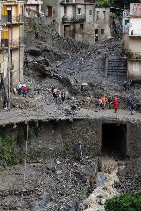 A collapsed road near the flood-ravaged town of Messina in north-eastern Sicily.