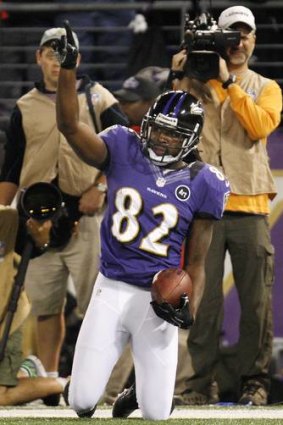Baltimore Ravens receiver Torrey Smith celebrates after scoring his first-half touchdown catch against the New England Patriots.