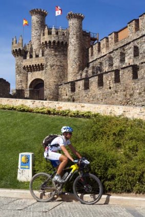 Cycling past the Knights Templar castle in Ponferrada.