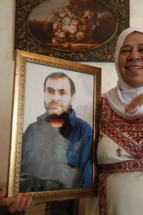 The mother of Palestinian prisoner Adnan Maragha and her son, who is among the 1,027 Palestinian prisoners to be freed in exchange for captured Israeli soldier Gilad Shalit.