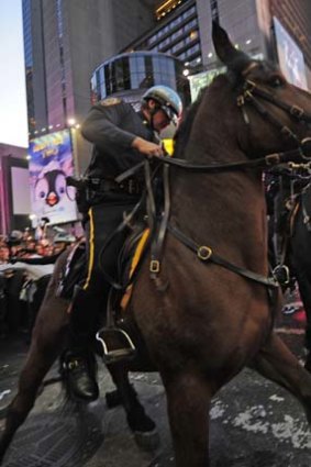 Mounted police prevent Occupy Wall Street demonstrators from breaking through a barricade in New York's Times Square.