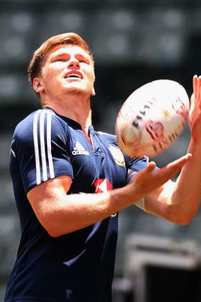 Tuning up: Owen Farrell catches the ball during training.