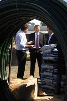 Member for Calare John Cobb and Opposition Leader Tony Abbott talk to Bill Reid Gibbs Farm Centre Managing Director during a visit to Queanbeyan.